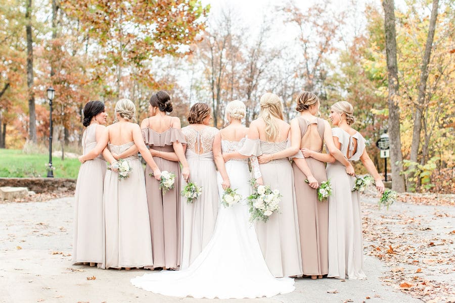 Bridal party's backs in group hug