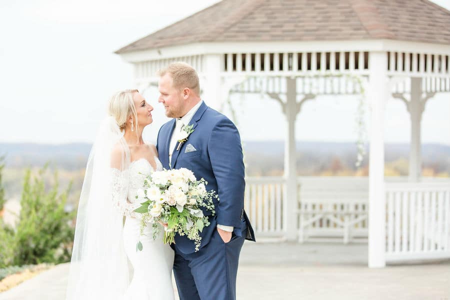 Bride and groom outside at gazebo