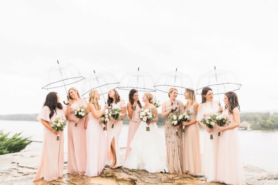 Bride with her Bridesmaids with clear umbrellas
