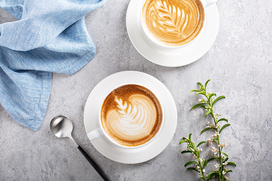 Two lattes on a counter