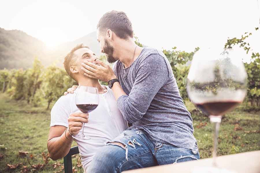 Happy couple drinking wine at a vineyard in Missouri