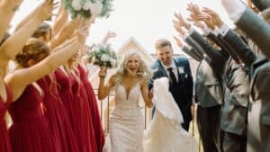 bride and groom running by their bridesmaids and groomsmen at the end of the ceremony